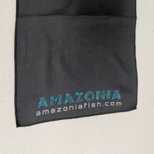 Black Amazonia waffle towel with the fish-pattern logo and amazoniafish.com